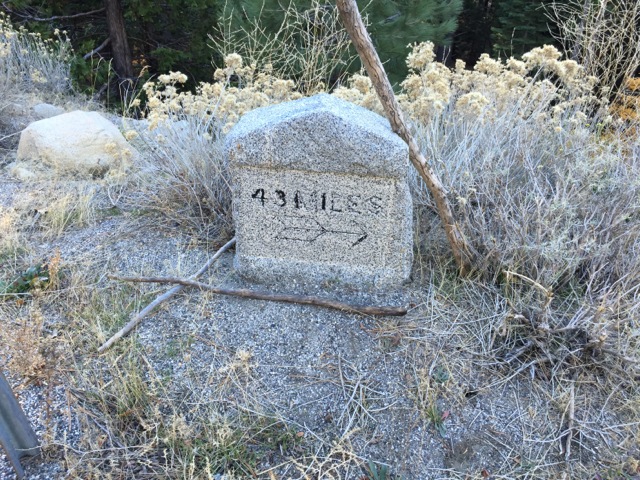 Old marker across the highway from the trail showing 43 miles to Placerville.